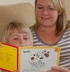 Parent listening to child read